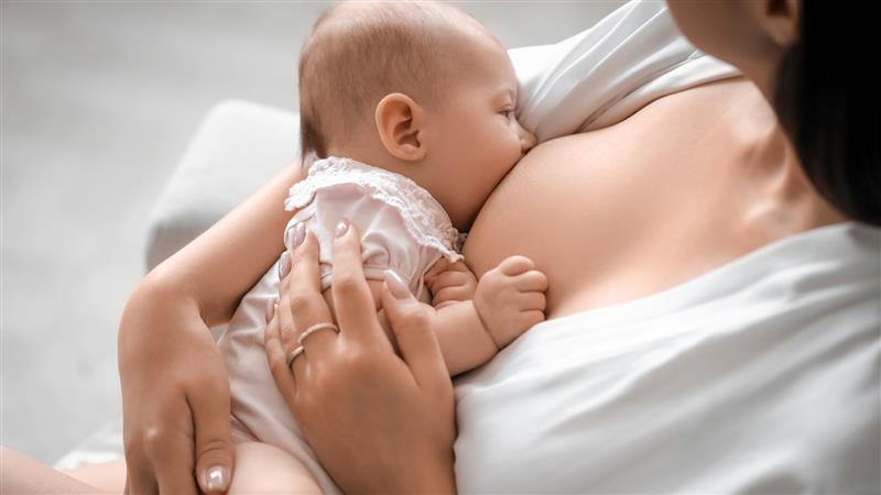 a woman breastfeeding her baby