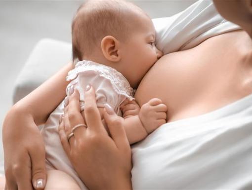 a woman breastfeeding her baby